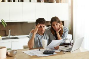 couple working through personal bankruptcy paperwork