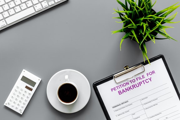 petition to file for bankruptcy form on a desk
