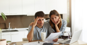 unhappy couple managing home accounts