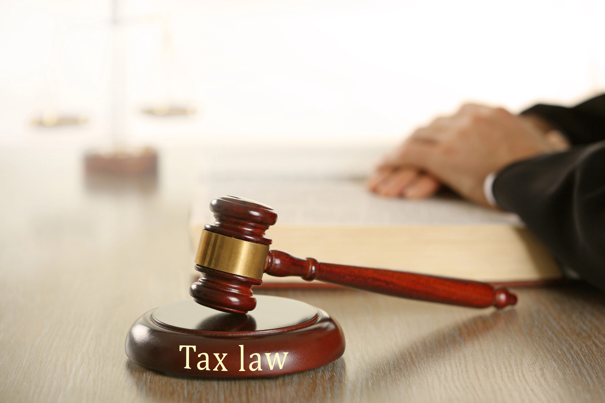 Wooden judges gavel on wooden table