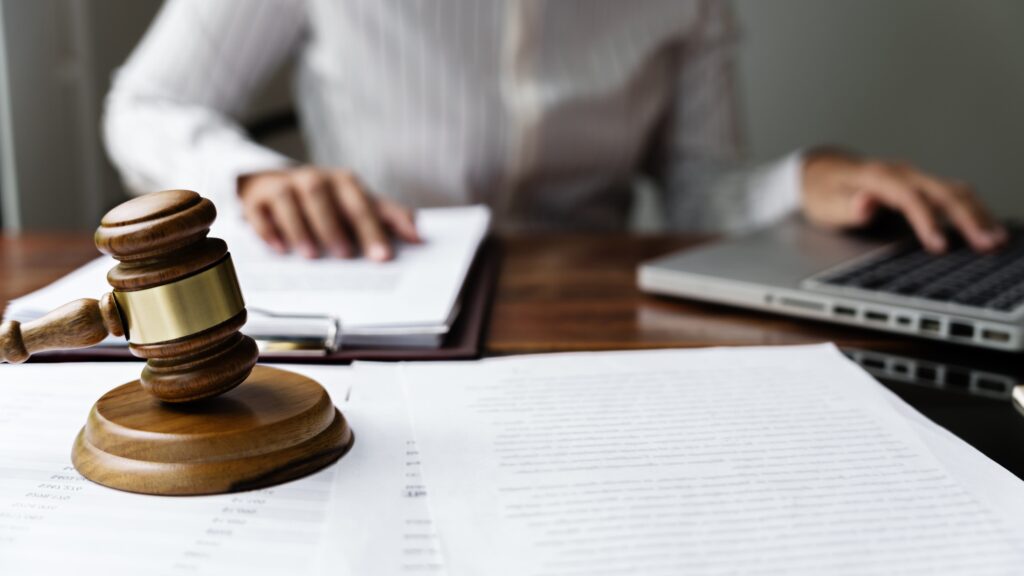 Lawyer working legal data contract at workplace